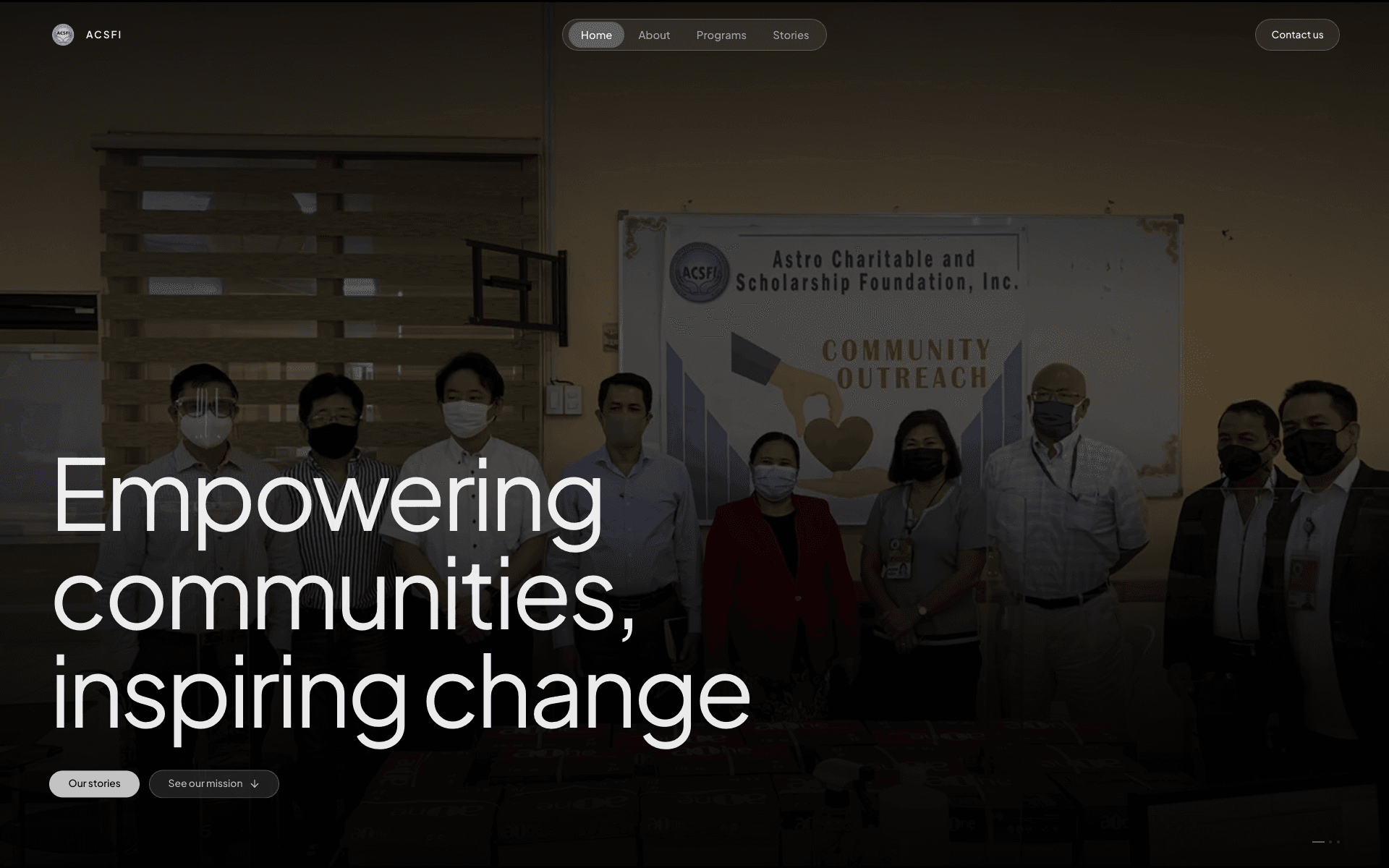 ACSFI homepage with a community outreach photograph and the message Empowering communities, inspiring change